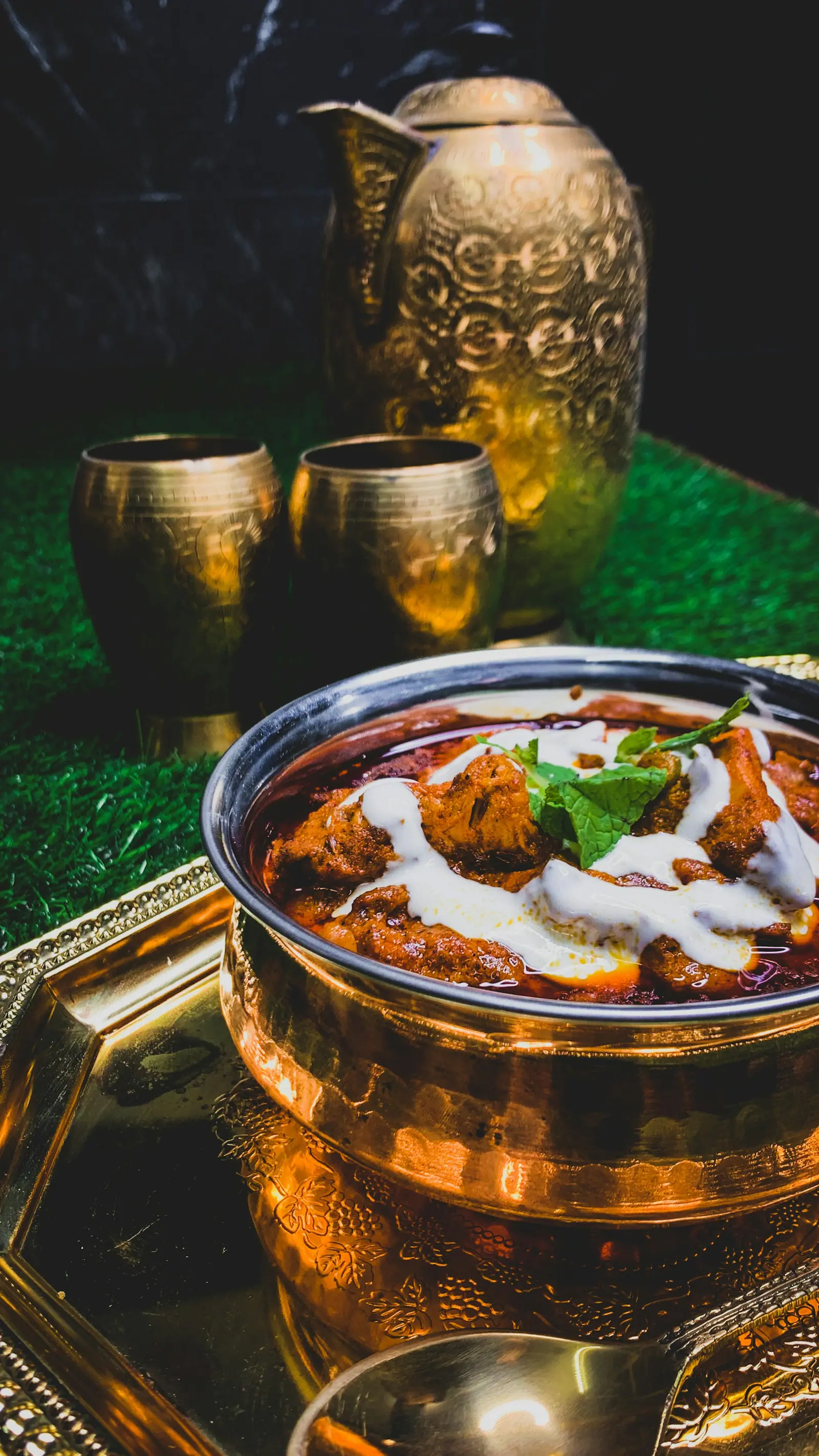 Curry in a brass serving bowl