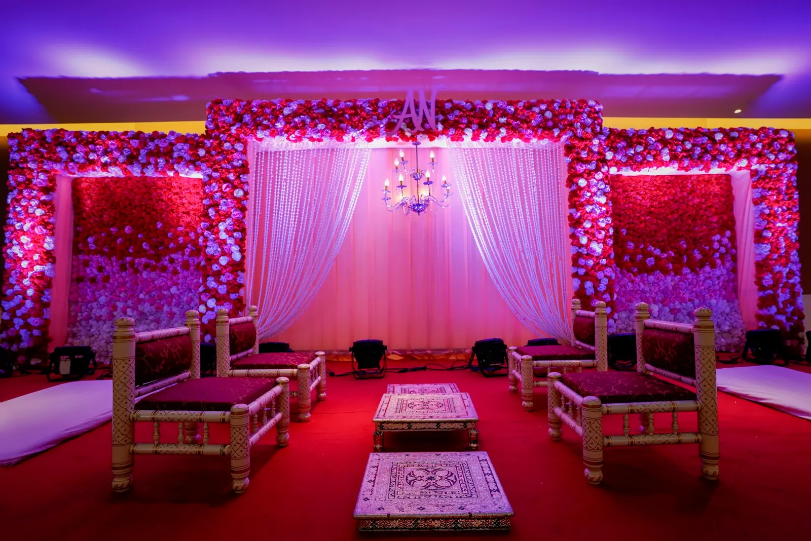 Pink and violet wedding reception stage