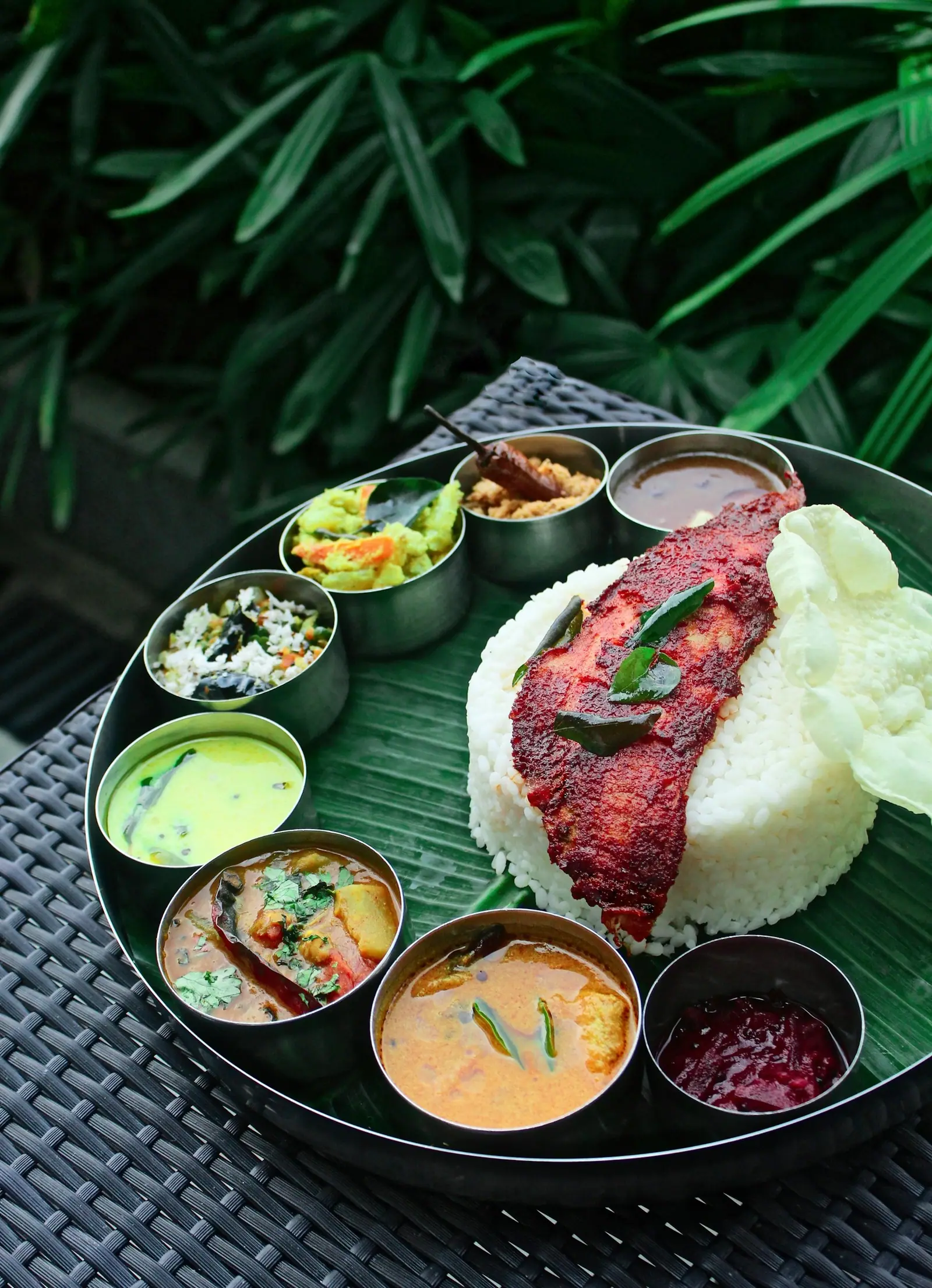 Banana leaf meal with fried fish and rice