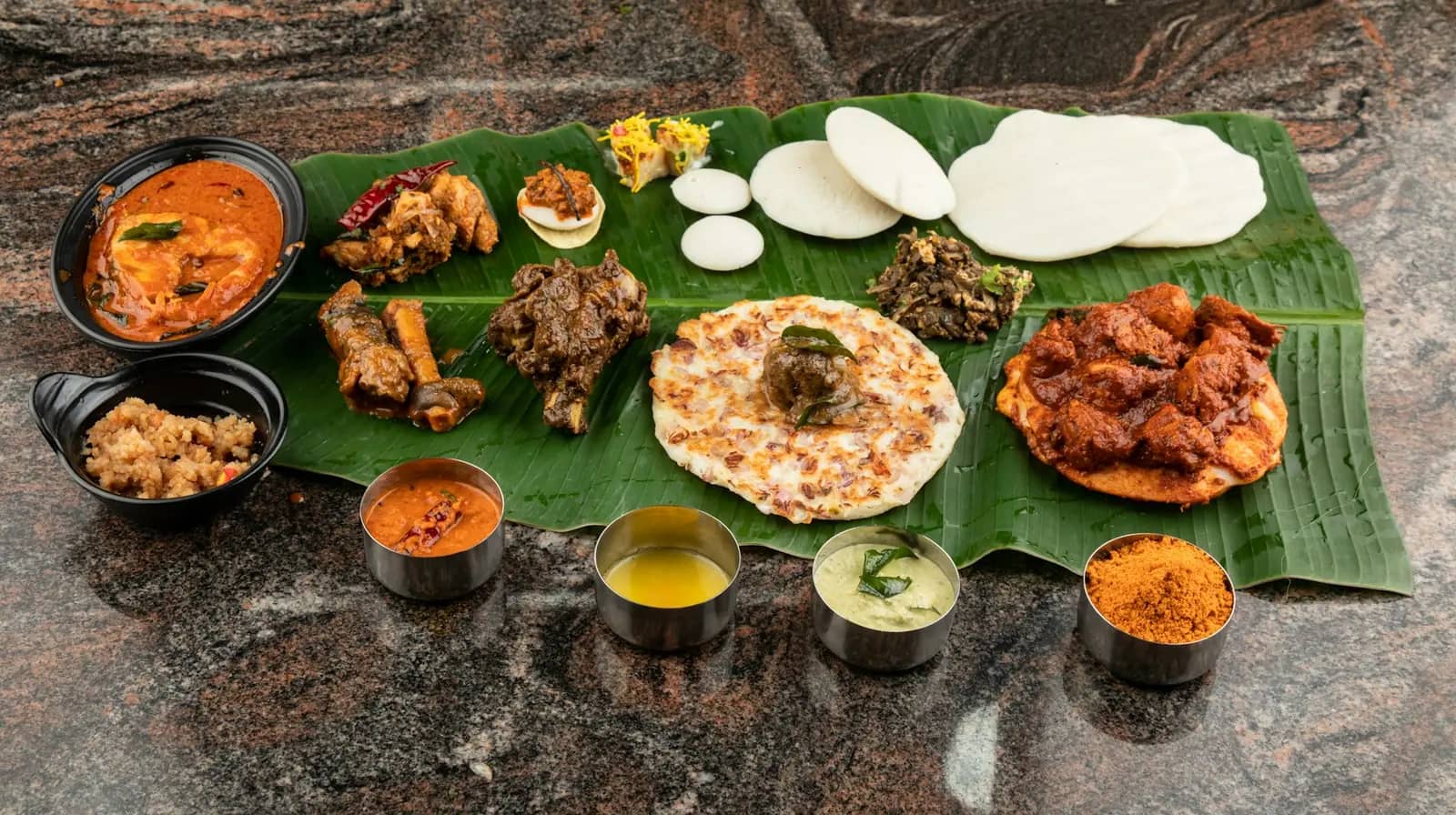 Full sadhya feast laid out on a banana leaf